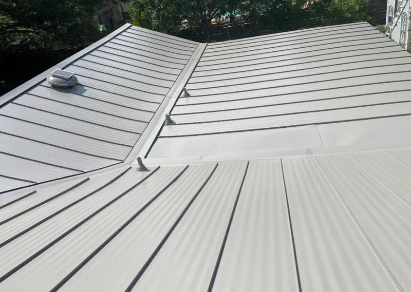Solar attic fan installed on a metal roof for Roof Ventilation in Horizon City